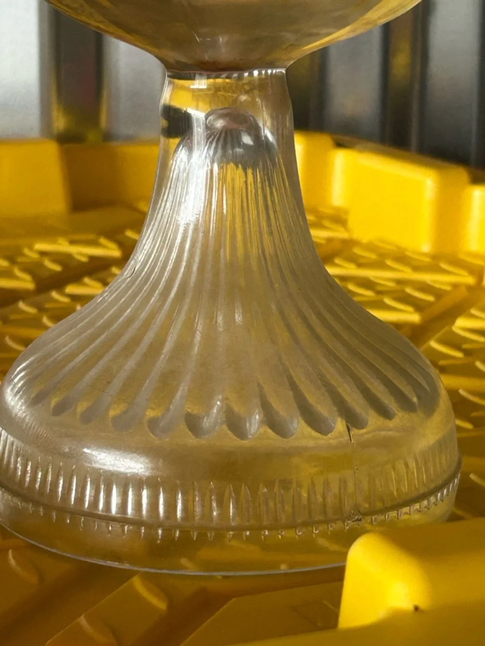 vintage clear glass kerosene oil lamp features a bulbous font and a ribbed base